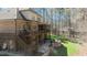 Expansive backyard with a multi-level deck and patio, complete with a cozy fire pit and seating area at 1009 High Trail Ct, Wake Forest, NC 27587