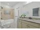 Bathroom featuring granite vanity with a sink, a shower-tub with tile surround and a toilet at 1009 High Trail Ct, Wake Forest, NC 27587