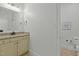 Well-lit bathroom featuring a granite vanity, modern fixtures, and a motivational wall decor at 1009 High Trail Ct, Wake Forest, NC 27587