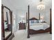 Bright bedroom with a four-poster bed and view of the bedroom furniture at 1009 High Trail Ct, Wake Forest, NC 27587