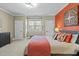 Comfortable bedroom with a warm color palette and a cozy window bench at 1009 High Trail Ct, Wake Forest, NC 27587