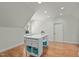 Spacious bonus room with wood floors and craft space at 1009 High Trail Ct, Wake Forest, NC 27587
