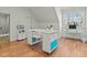 Spacious bonus room with modern white desks, storage, and a large window offering plenty of natural light at 1009 High Trail Ct, Wake Forest, NC 27587