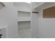 Bright walk-in closet with built in shelving at 1009 High Trail Ct, Wake Forest, NC 27587