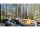 A cozy outdoor fire pit surrounded by comfortable seating, perfect for entertaining guests at 1009 High Trail Ct, Wake Forest, NC 27587