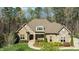 Charming brick and stone home with meticulously landscaped front yard and covered front porch at 1009 High Trail Ct, Wake Forest, NC 27587