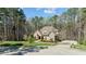 Traditional home exterior with a blend of stone and brickwork, complemented by a well-manicured front yard at 1009 High Trail Ct, Wake Forest, NC 27587