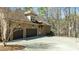 Spacious two-car garage with an extended driveway, basketball hoop, and meticulous landscaping at 1009 High Trail Ct, Wake Forest, NC 27587