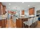 Spacious kitchen with two islands, stainless steel appliances, custom cabinetry and hardwood floors at 1009 High Trail Ct, Wake Forest, NC 27587