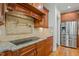 Kitchen featuring a pot filler, stainless steel appliances, custom cabinets, granite countertops at 1009 High Trail Ct, Wake Forest, NC 27587