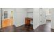 Office nook with hardwood floors, desk, and white wall paneling at 1009 High Trail Ct, Wake Forest, NC 27587