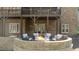 A relaxing backyard patio with a cozy fire pit and comfortable seating under the deck at 1009 High Trail Ct, Wake Forest, NC 27587