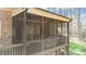 Back of a screened porch, with exterior lights. Great for outdoor entertaining at 1009 High Trail Ct, Wake Forest, NC 27587