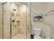 Bathroom with a glass-enclosed shower and travertine tile at 1009 High Trail Ct, Wake Forest, NC 27587