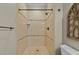 Elegant walk-in shower with tiled walls and bronze fixtures at 1009 High Trail Ct, Wake Forest, NC 27587