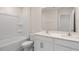 New bathroom with double sink vanity, white cabinets and a tub at 1100 Ursa Major Ct, Wendell, NC 27591