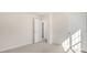 Neutral bedroom featuring a closet, door, and plush carpet at 1100 Ursa Major Ct, Wendell, NC 27591