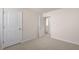 Bedroom with a carpeted floor and multiple doors at 1100 Ursa Major Ct, Wendell, NC 27591