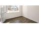 Bright room featuring a large window and luxury vinyl plank flooring at 1100 Ursa Major Ct, Wendell, NC 27591
