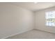 A bedroom with neutral paint color, carpet and window at 1100 Ursa Major Ct, Wendell, NC 27591