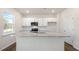 A kitchen featuring white cabinets, granite countertops, stainless steel appliances, and luxury vinyl plank floors at 1100 Ursa Major Ct, Wendell, NC 27591