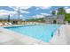 Community swimming pool featuring a clean, inviting design with ample seating and a modern pool house for residents to enjoy at 1100 Ursa Major Ct, Wendell, NC 27591