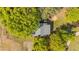 Aerial view showcasing the home's placement on the lot and surrounding trees at 1188 Turner Rd, Creedmoor, NC 27522