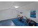 Well-lit basement featuring a drum set, Beatles poster, and blue carpet, ideal for a recreation area at 1188 Turner Rd, Creedmoor, NC 27522