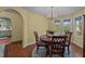 Charming dining room with hardwood floors, chandelier, and views into the kitchen at 1188 Turner Rd, Creedmoor, NC 27522