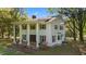 Charming two-story home featuring a wide front porch, columns, and well-maintained landscaping at 1188 Turner Rd, Creedmoor, NC 27522