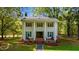 Stately two-story home with a columned porch, symmetrical design, and beautiful front yard at 1188 Turner Rd, Creedmoor, NC 27522