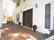 Inviting front porch featuring brick flooring, decorative lighting, and comfortable seating at 1188 Turner Rd, Creedmoor, NC 27522