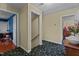 Hallway with carpet flooring, access to office, stairs and other rooms at 1188 Turner Rd, Creedmoor, NC 27522