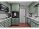 Well-equipped kitchen with stainless steel appliances and sage green cabinets at 1188 Turner Rd, Creedmoor, NC 27522