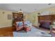Comfortable living room featuring a fireplace, hardwood floors, and stylish furniture at 1188 Turner Rd, Creedmoor, NC 27522