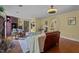 Charming living room with leather sofa and wood floors, creating a cozy and inviting space at 1188 Turner Rd, Creedmoor, NC 27522