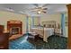 The main bedroom features a fireplace, ceiling fan, and two windows at 1188 Turner Rd, Creedmoor, NC 27522