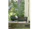 Two peacocks sitting on a bench on a brick patio at 1188 Turner Rd, Creedmoor, NC 27522