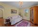 Elegant sitting room featuring a comfortable couch, hardwood floors, and a chandelier at 1188 Turner Rd, Creedmoor, NC 27522