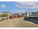 Backyard featuring a well-maintained lawn, privacy fence, and a storage shed, perfect for outdoor activities at 1208 Wind Rose Dr, Fuquay Varina, NC 27526