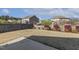 The Backyard features a well-maintained lawn, privacy fence, and mature landscaping, perfect for outdoor activities at 1208 Wind Rose Dr, Fuquay Varina, NC 27526
