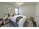 A cozy bedroom with decor and a comfortable bed that creates a relaxing and inviting space at 1208 Wind Rose Dr, Fuquay Varina, NC 27526