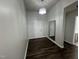 Foyer featuring a door, a mirror and a decorative light fixture at 1208 Wind Rose Dr, Fuquay Varina, NC 27526