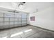 Spacious garage with an automatic door, providing secure parking and storage for your vehicles and belongings at 1208 Wind Rose Dr, Fuquay Varina, NC 27526