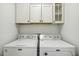 Practical laundry room with plenty of storage space and modern appliances for your laundry needs at 1208 Wind Rose Dr, Fuquay Varina, NC 27526