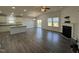 Spacious living room and kitchen area with fireplace at 1208 Wind Rose Dr, Fuquay Varina, NC 27526