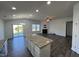 Inviting living space featuring an open floor plan, neutral palette, and smooth transition to the kitchen at 1208 Wind Rose Dr, Fuquay Varina, NC 27526