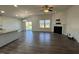 Well-lit living room includes a modern ceiling fan, a cozy fireplace, and access to the outdoor space at 1208 Wind Rose Dr, Fuquay Varina, NC 27526