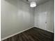 An empty room featuring a door and a modern light fixture at 1208 Wind Rose Dr, Fuquay Varina, NC 27526