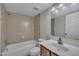 Bathroom featuring a tub/shower combo, neutral tile, and vanity at 1283 Schaub Dr # B, Raleigh, NC 27606